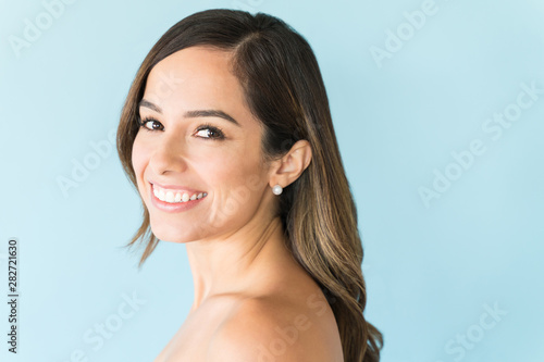 Portrait Of Good Looking Happy Female Over Colored Background