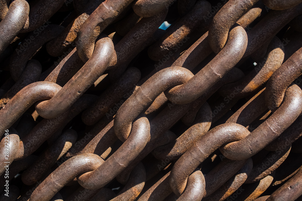 Background or texture from big metal and rusty chains and links.