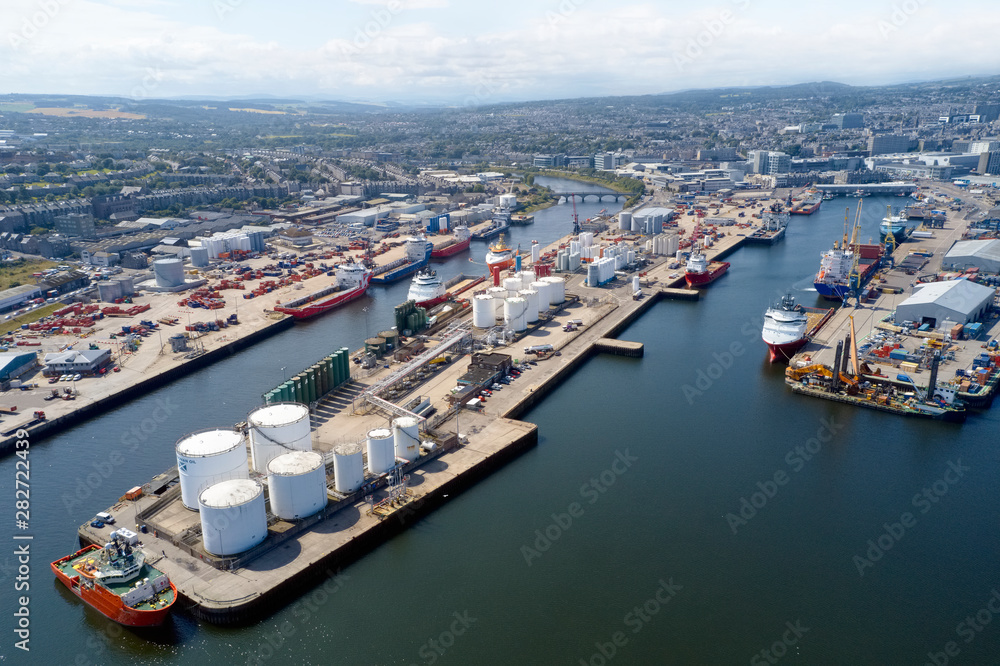 Aerial view of Aberdeen harbour ships with oil & gas tanks and sea vessels