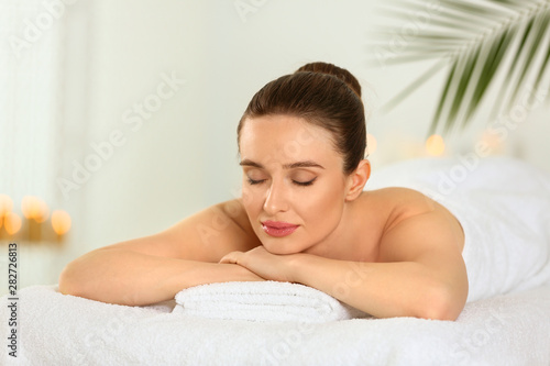 Beautiful young woman relaxing in spa salon © New Africa