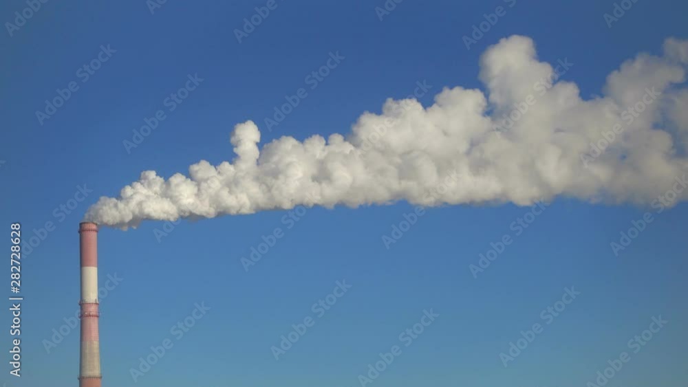 Time lapse, one pipe and smoke against blue sky. Time lapse, one pipe and smoke against blue sky.
