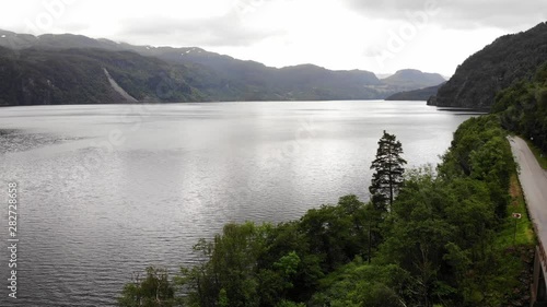 Aerial view. Norwegian landscape. Road in Mountains and fjord Saudafjord, overcast weather. National tourist Ryfylke route photo