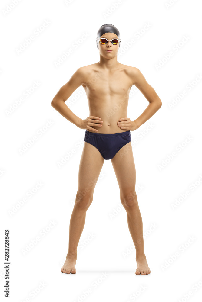 Young male swimmer posing with cap and goggles Young male swimmer posing with cap and goggles