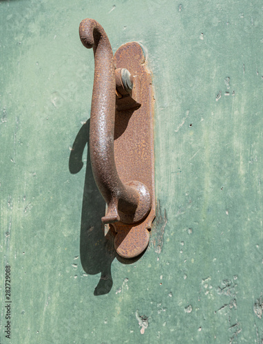 Old house knocker detail in the historic center of the city of Cuenca, Spain, Europe photo