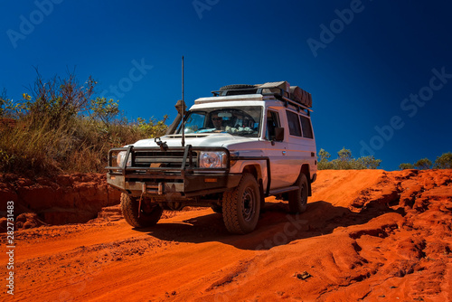 Western Australia – Outback track with 4WD car downhill to the ocean at Dampier Peninsula photo