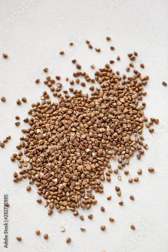 Pile of buckwheat isolated on white background. Top view.