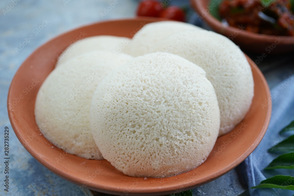 Fototapeta premium South Indian breakfast Idlis with Tomato chutney, selective focus