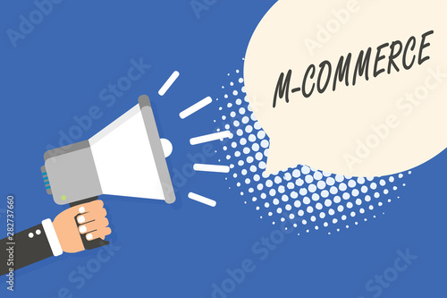 Conceptual hand writing showing M Commerce. Business photo text commercial transactions conducted electronically by mobile phone Man holding megaphone loudspeaker speech bubble blue background photo