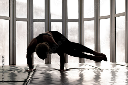 Fototapeta Naklejka Na Ścianę i Meble -  Beautiful woman coach yoga practice. Yoga concept. Handstand, side legs
