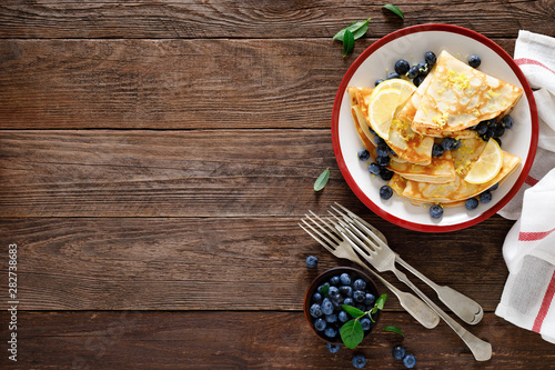 Sweet crepes filled with fresh blueberry photo