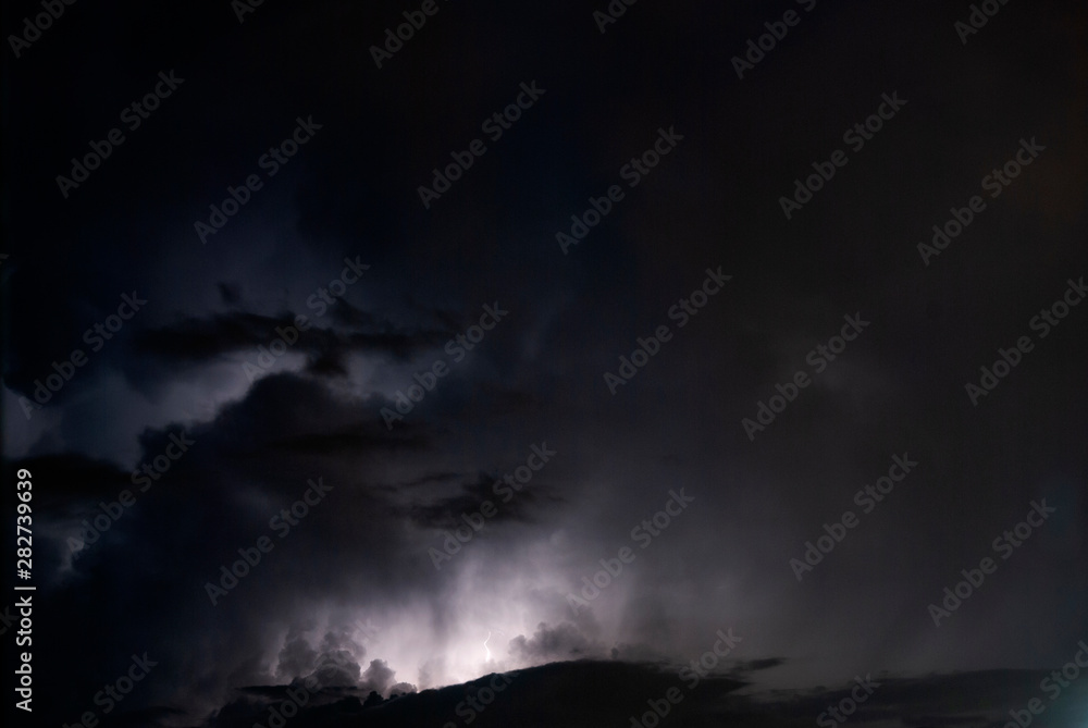 Night clouds thunderstorm, light power in the sky, latin america, long exposure.