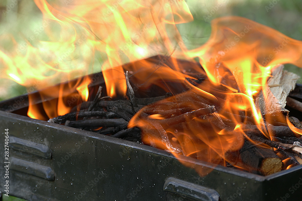 slow motion barbecue fire, burn brazier, close-up flame.