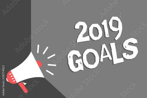 Text sign showing 2019 Goals. Conceptual photo A plan to do for something new and better for the coming year Megaphone loudspeaker gray background important message speaking loud photo