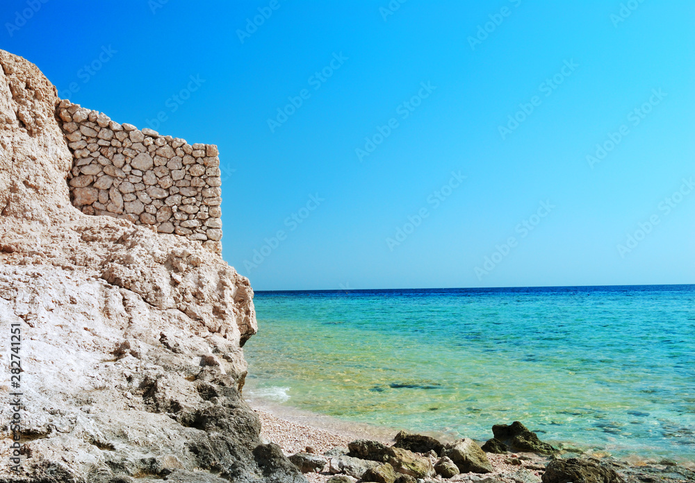 sea and stone wall