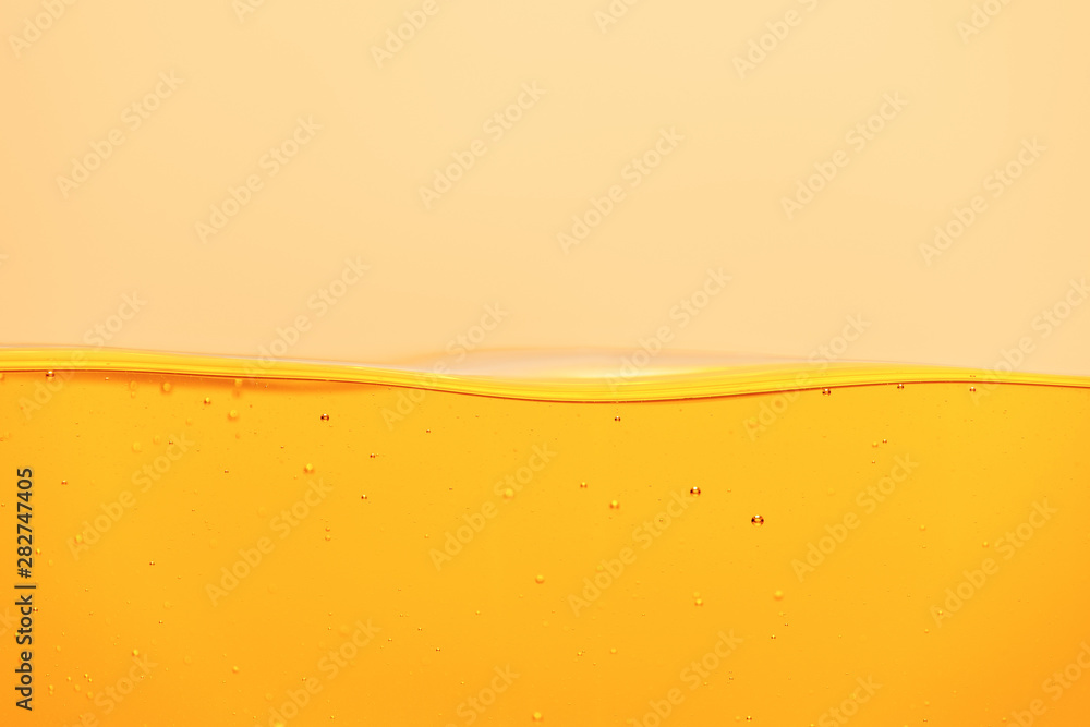 yellow bright liquid with underwater bubbles isolated on yellow yellow bright liquid with underwater bubbles isolated on yellow