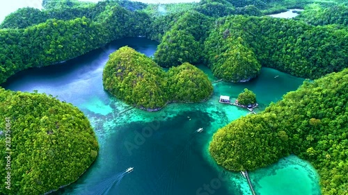 Tropical landscape rainforest hills and azure water in lagoon with clouds on the Siargao island, Philippines. Drone Aerial view 4Kl