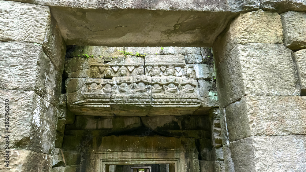 carved lintel with seated figures at preah khan temple