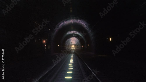 Extreme train coming towards camera in a railway tunnel. Representing achieving your goals, getting through problems and obstacles or problems seem bigger than they really are