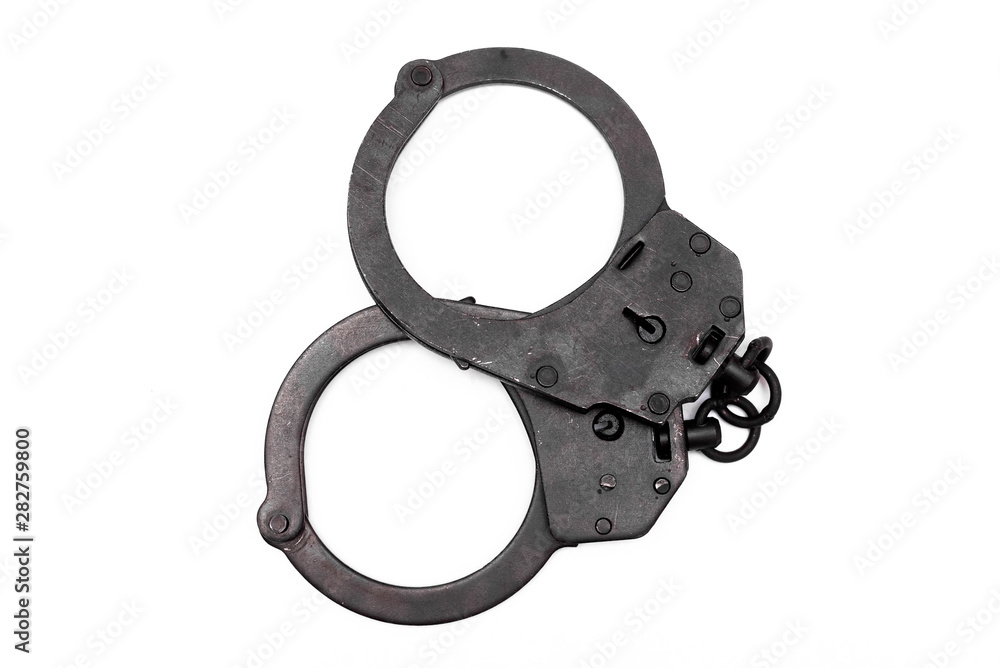 Obraz premium Black handcuffs isolated on the white background.