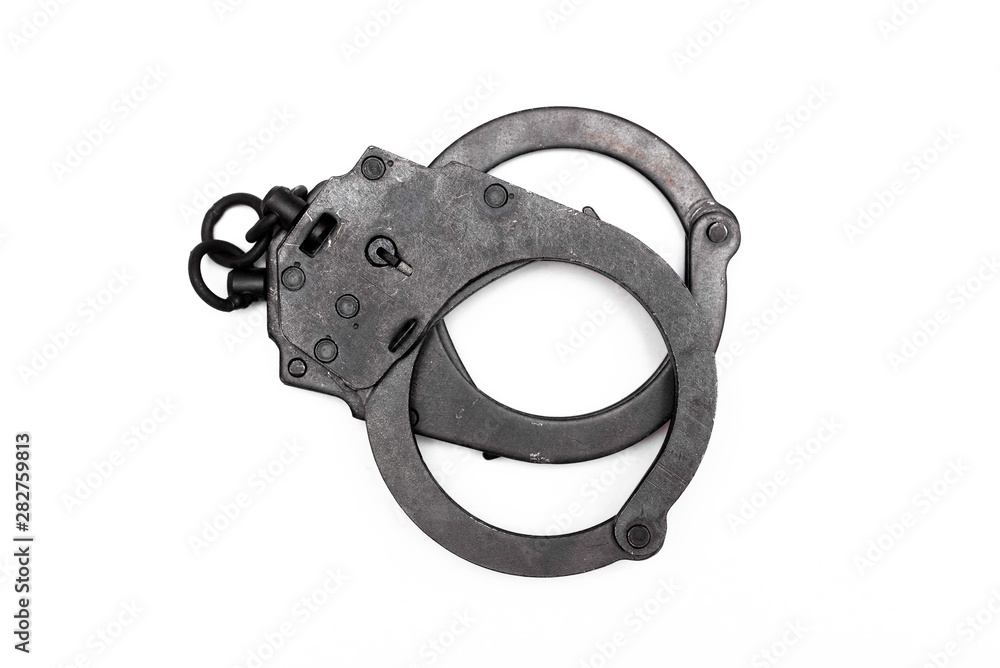 Obraz premium Black handcuffs isolated on the white background.