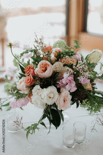 Modern Wedding Table Decor, Roses and peonies in vase at wedding reception, floral arrangement, trendy rustic garden flowers