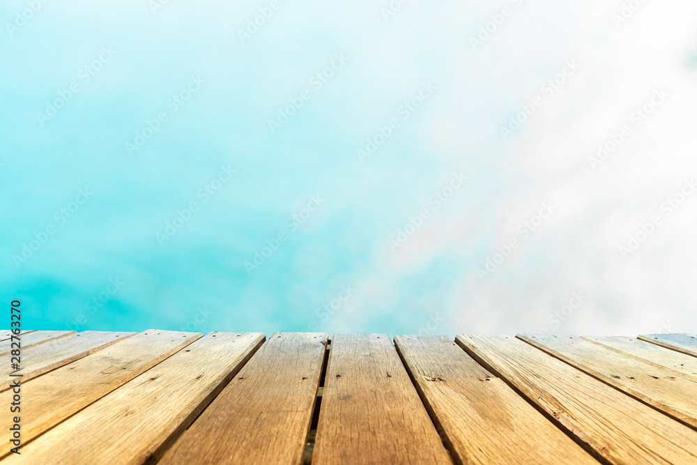 Selective focus of old wood table with beautiful beach background for display your product. Selective focus of old wood table with beautiful beach background for display your product.
