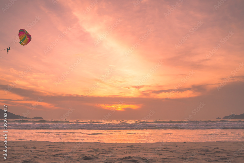Sunset lovers, bright orange sky, on the beach Famous Phuket Patong Thailand Sunset lovers, bright orange sky, on the beach Famous Phuket Patong Thailand