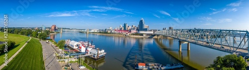 Panoramic aerial view of Cincinnati downtown with building reflection on the Ohio river on a sunny summer morning
