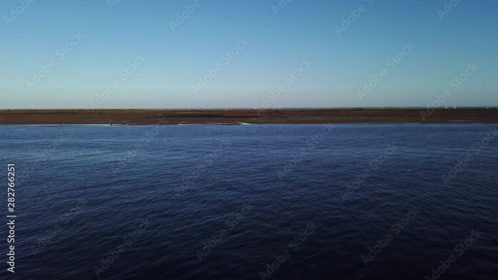Looking out over Ria Formosa at low tide near Olhao, Algarve, Portugal. Looking out over Ria Formosa at low tide near Olhao, Algarve, Portugal.