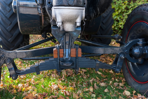 Suspension of an old tractor with tyres photo