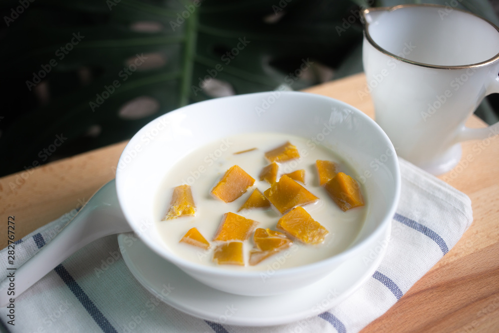 Thai dessert: Pumpkin in sweet coconut milk, Coconut Milk Stewed Pumpkin bowl. (Buak Phak Tong) Thai dessert: Pumpkin in sweet coconut milk, Coconut Milk Stewed Pumpkin bowl. (Buak Phak Tong)