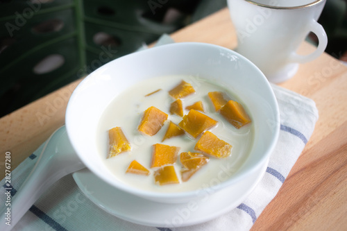 Thai dessert: Pumpkin in sweet coconut milk,  Coconut Milk Stewed Pumpkin bowl. (Buak Phak Tong) photo