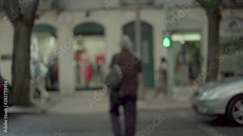 Wallpaper Mural Man zebra crossing with green traffic light, out of focus camera, in slow motion Torontodigital.ca