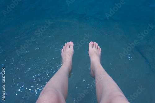 woman legs in the water