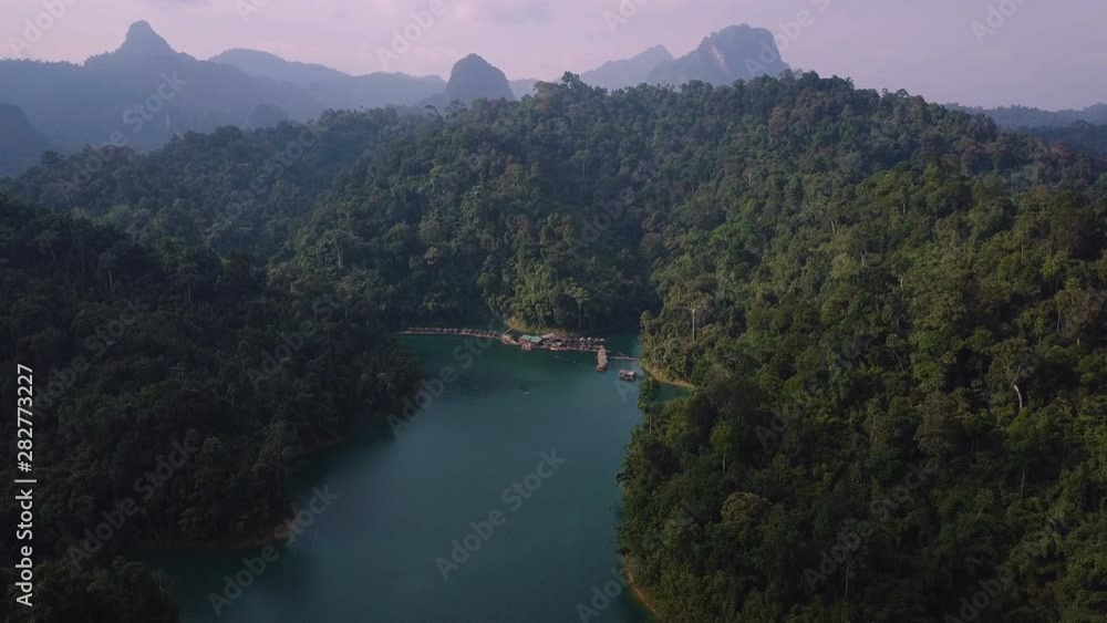 Drone shot of floating raft houses in Khlong Phanom national park in Thailand Drone shot of floating raft houses in Khlong Phanom national park in Thailand