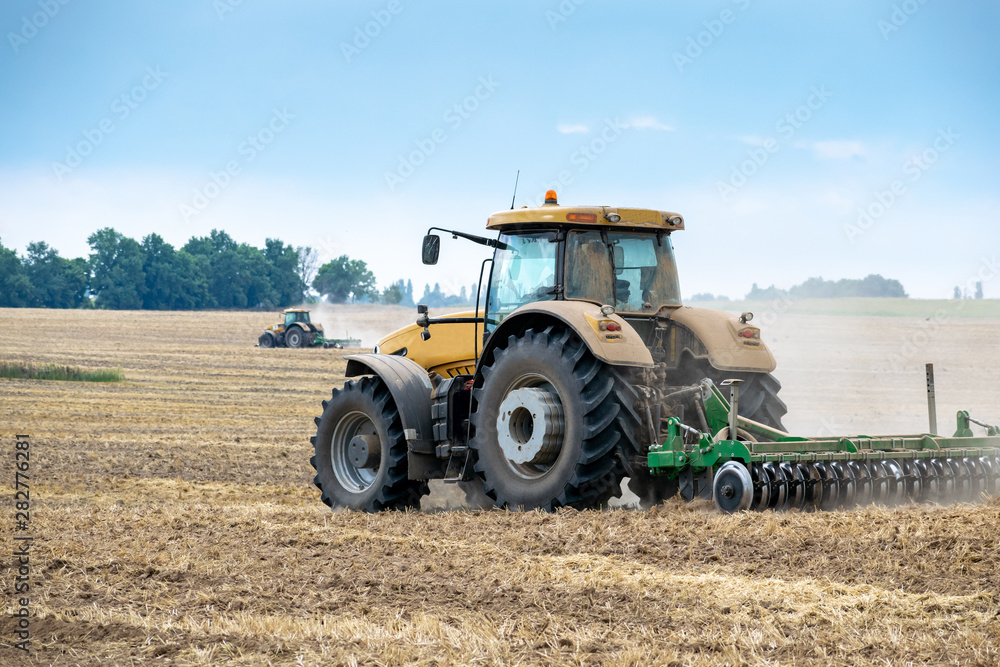 Tractor cultivating the field Tractor cultivating the field