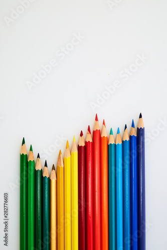 Colorful wooden pencils for drawing on white