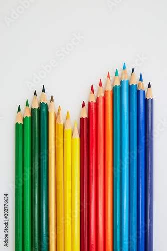Colorful wooden pencils for drawing on white
