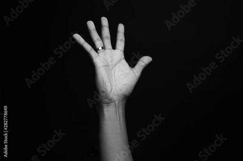 Hand with a ring and dark background. Luis's Hand