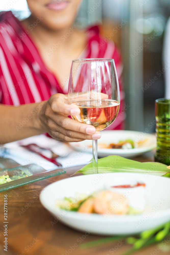 Woman holding wine glass Woman holding wine glass