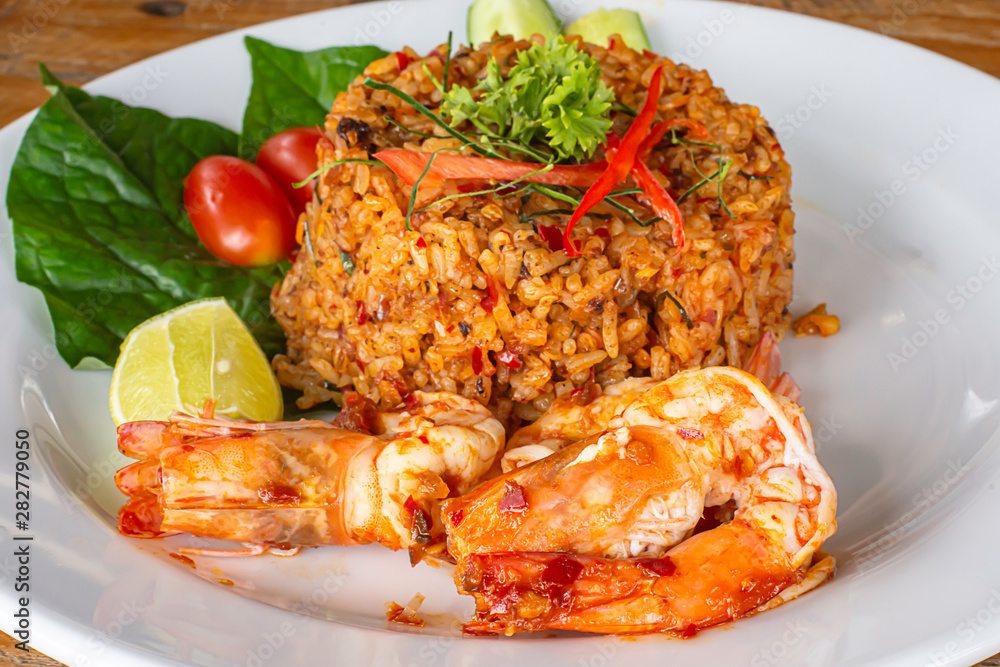 Fried rice with Shrimp on wooden table , spicy food Thai style. Fried rice with Shrimp on wooden table , spicy food Thai style.