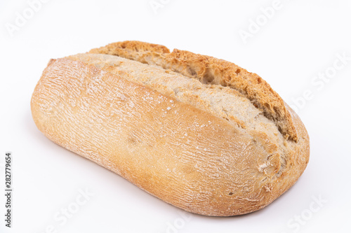 Loaf of a delicious bread isolated on white. Close up