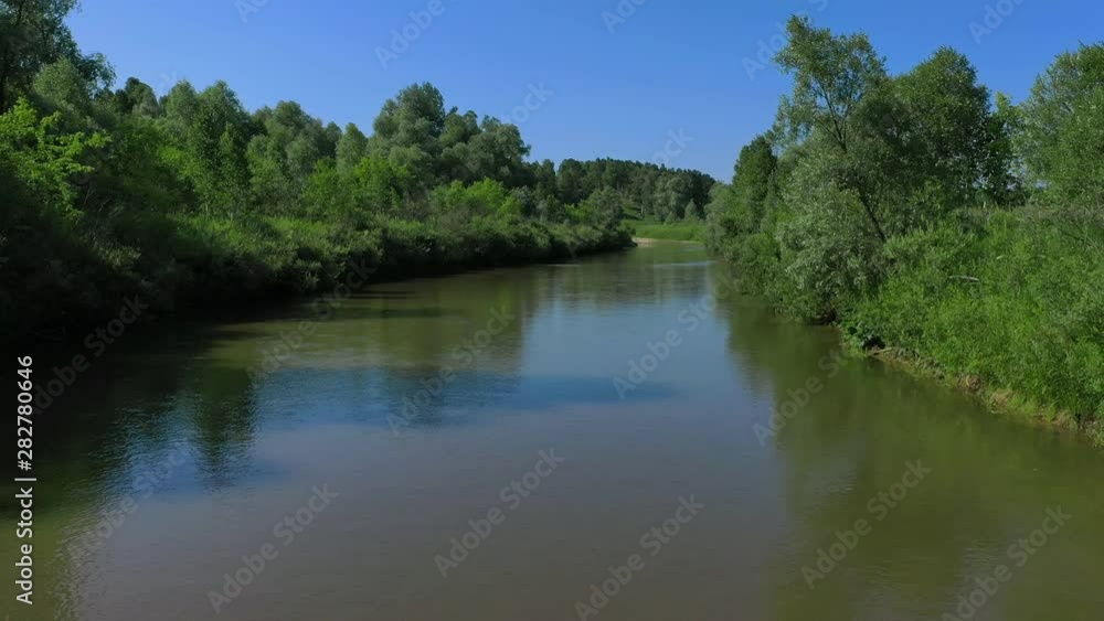 Aerial View. Low flight over river carving its way through the summer valley. Aerial View. Low flight over river carving its way through the summer valley.