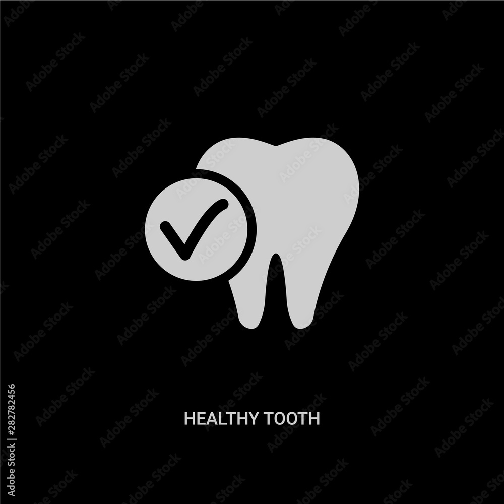 Obraz premium white healthy tooth vector icon on black background. modern flat healthy tooth from dentist concept vector sign symbol can be use for web, mobile and logo.