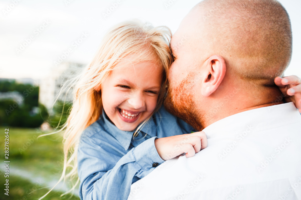 Happy father and child spending time outdoors. Beautiful blonde daughter. Happy father and child spending time outdoors. Beautiful blonde daughter.