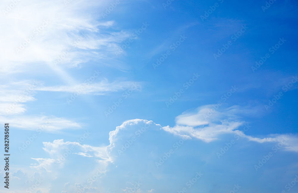Clear blue sky and white cloud with sunlight from the sun,nature background in sunshine day Clear blue sky and white cloud with sunlight from the sun,nature background in sunshine day