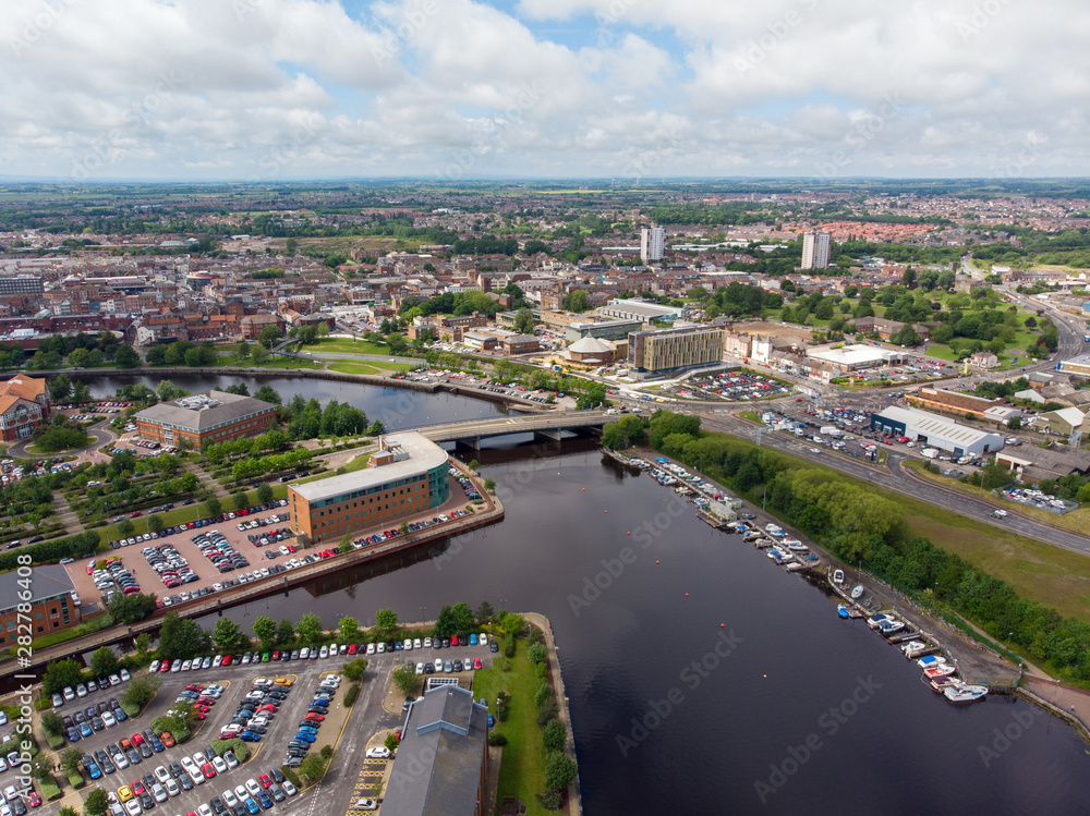 Obraz premium Aerial photo of the River Tee in Middlesbrough a large post-industrial town in the county of North Yorkshire, England, taken on a bright sunny day