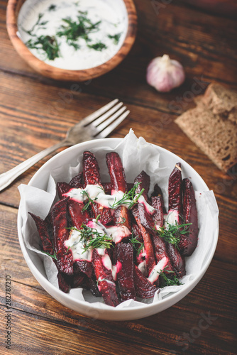 Baked beet fries with greek yogurt and dill photo