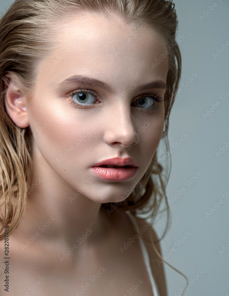 Perfectly retouched beauty photo of young beautiful girl. Wet hair and sensual look. Perfectly retouched beauty photo of young beautiful girl. Wet hair and sensual look.