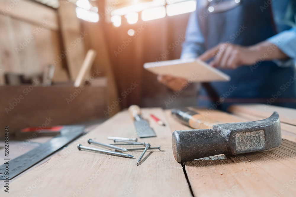 Carpenter on workplace in carpentry workshop. Carpenter on workplace in carpentry workshop.